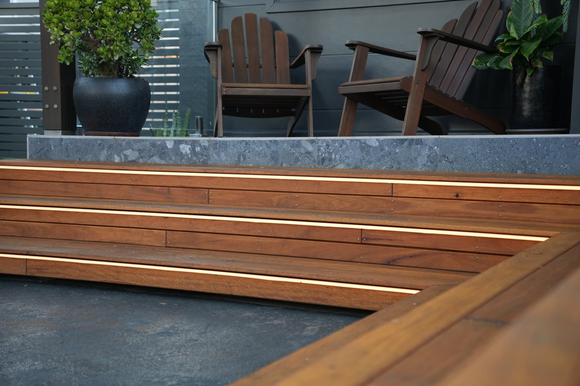 Hardwood deck with mitred picture-frame steps and recessed lighting, built by JTR Built in Newcastle